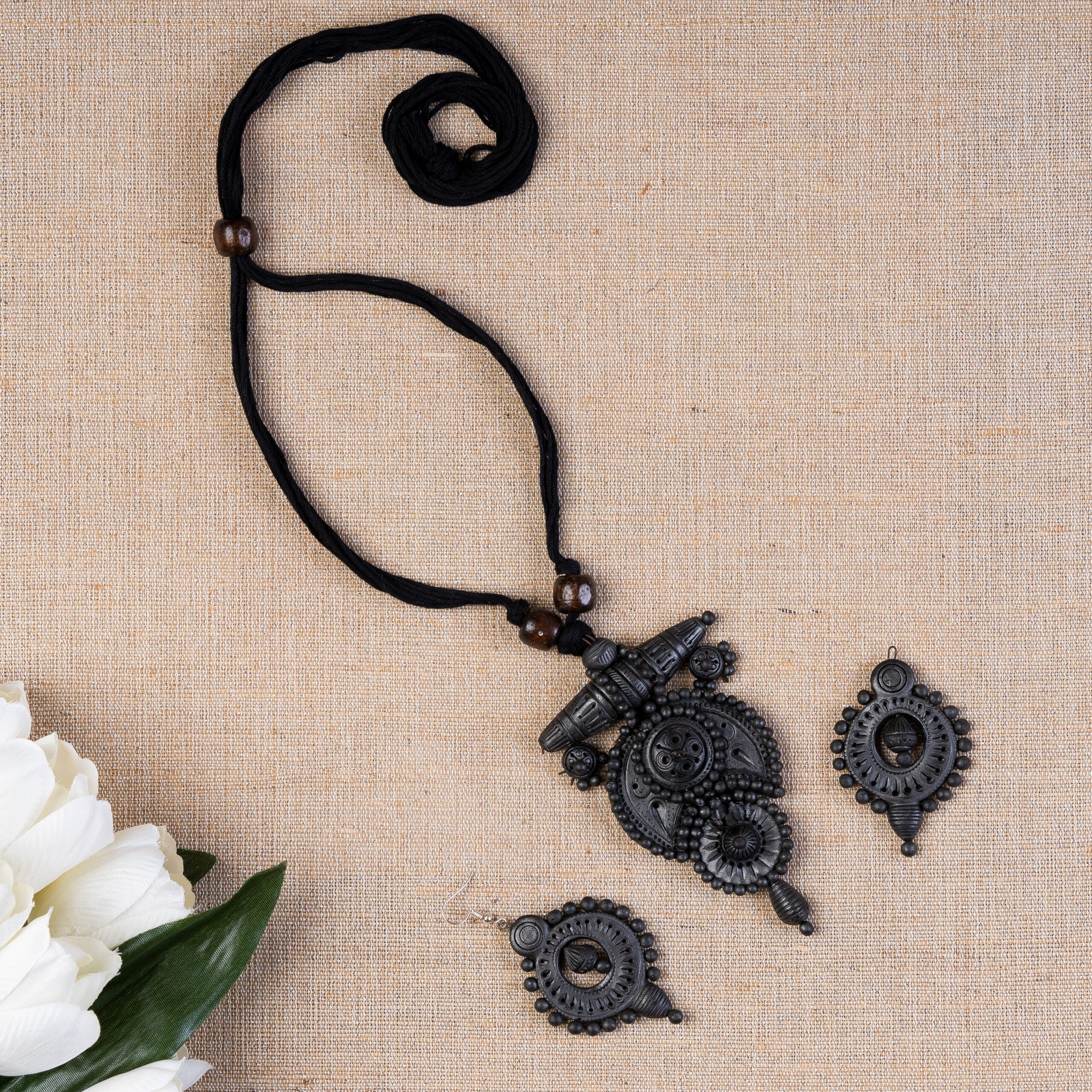 Petal-sculpted terracotta shrine pendant