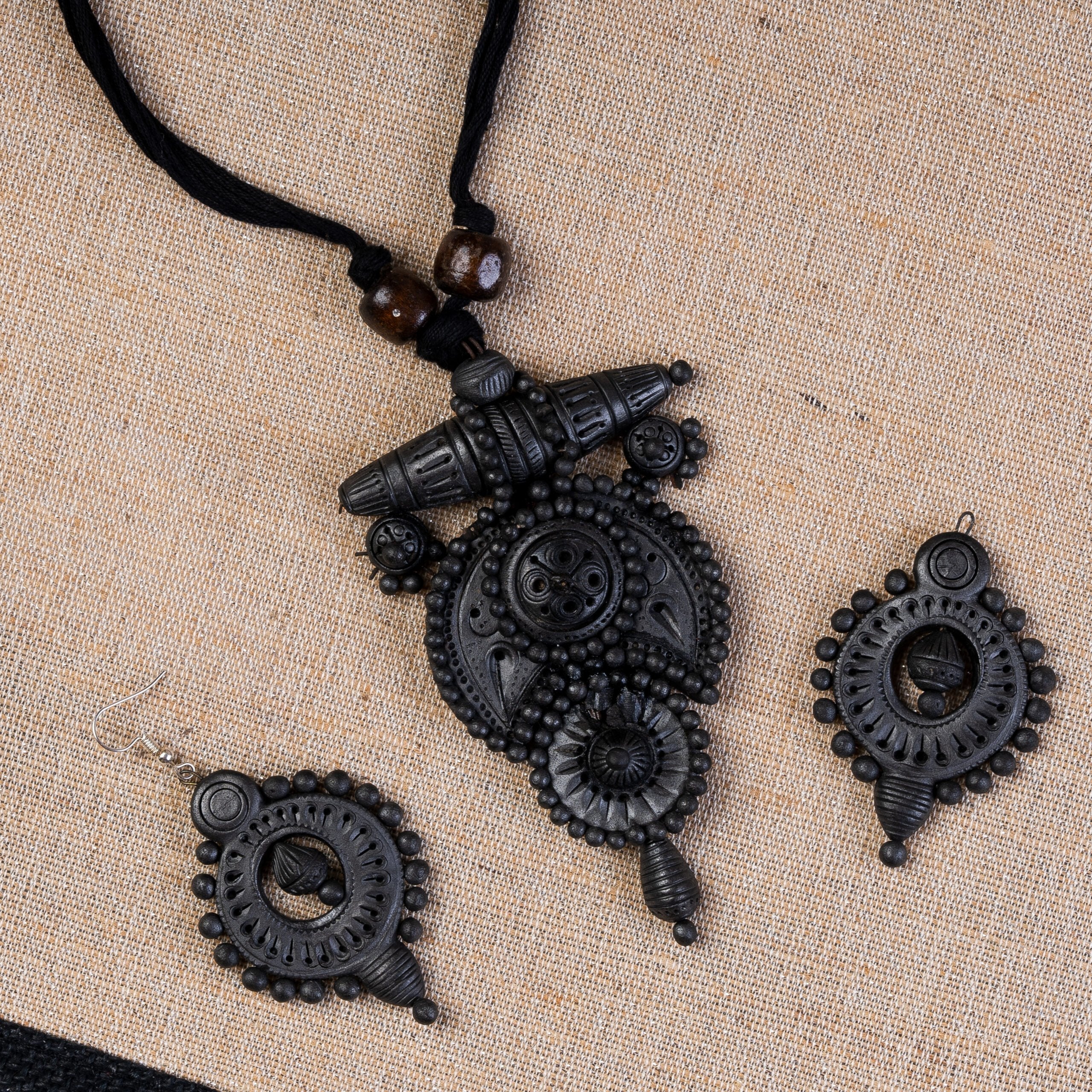 Petal-sculpted terracotta shrine pendant