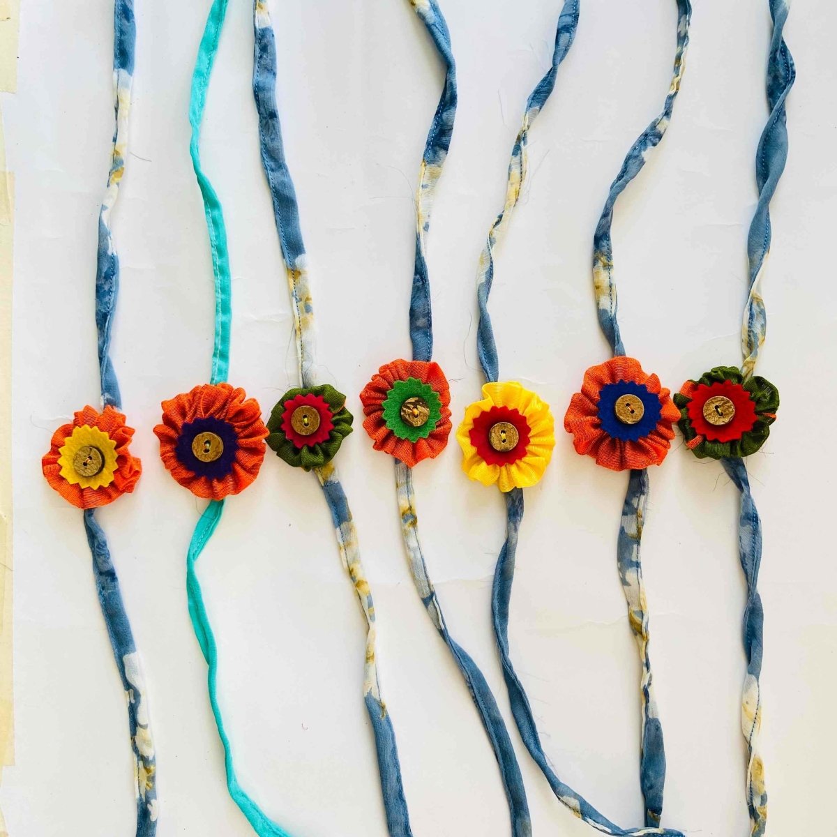 Earth Friendly Rakhis- Orange and Green with Coconut Buttons