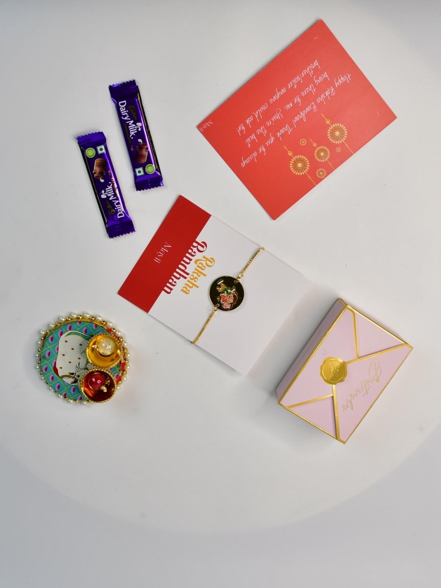 Sowpeace Exquisite Bhai Behen Rakhi Pack of 1 with Roli Chawal Thali, two Chocolates, and Greeting card combo for Raksha Bandhan and Gifting