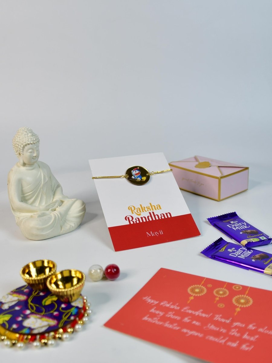 Sowpeace Exquisite Doraemon Rakhi Pack of 1 with Roli Chawal Thali, Chocolates, Buddha and Greeting card combo for Raksha Bandhan and Gifting