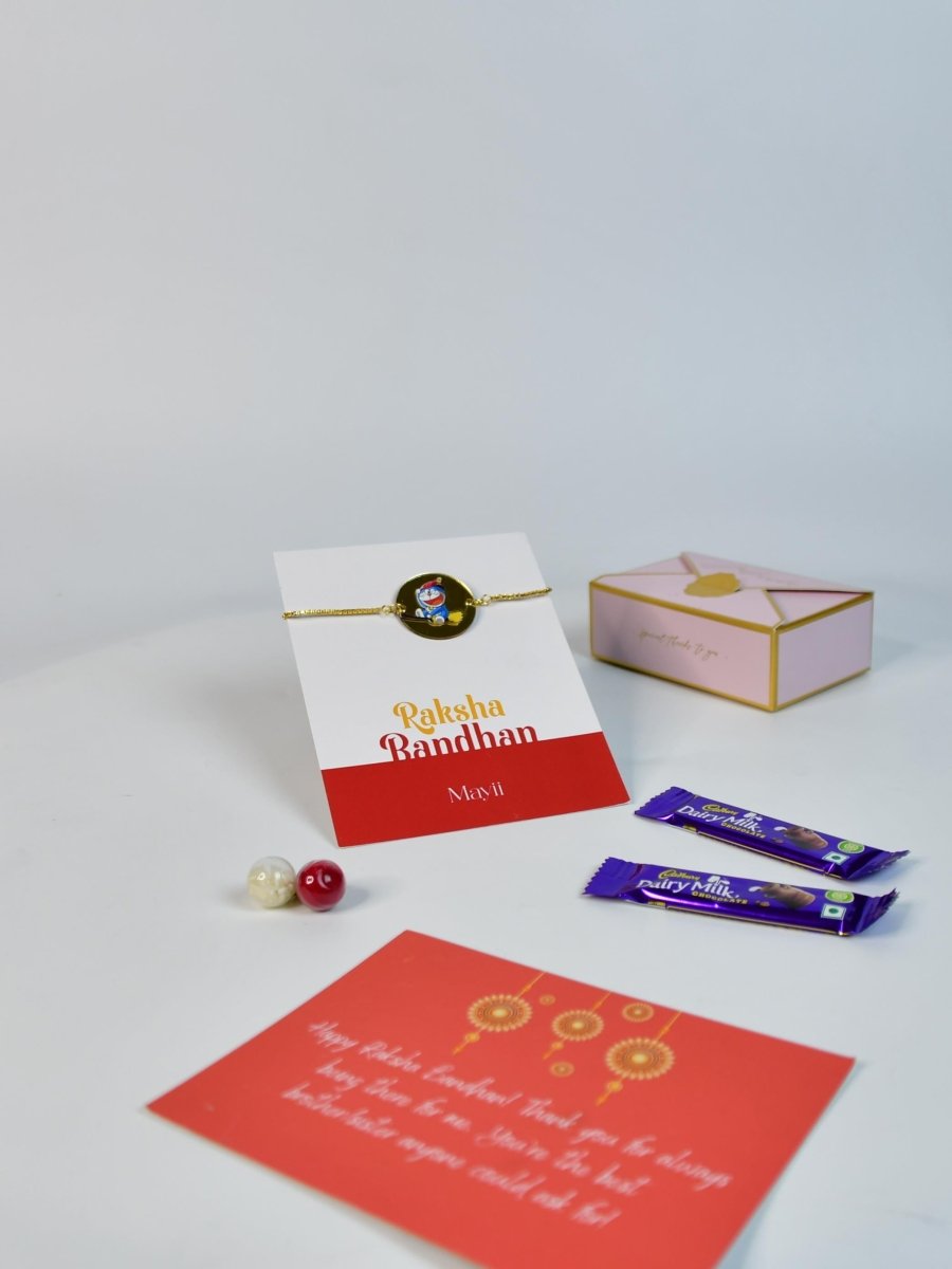 Sowpeace Exquisite Doraemon Rakhi Pack of 1 with Roli Chawal Thali, two Chocolates, and Greeting card combo for Raksha Bandhan and Gifting