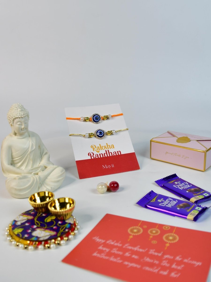 Sowpeace Exquisite Evil Eye Rakhi Pack of 1 with Roli Chawal Thali, Chocolates, Buddha and Greeting card combo for Raksha Bandhan and Gifting