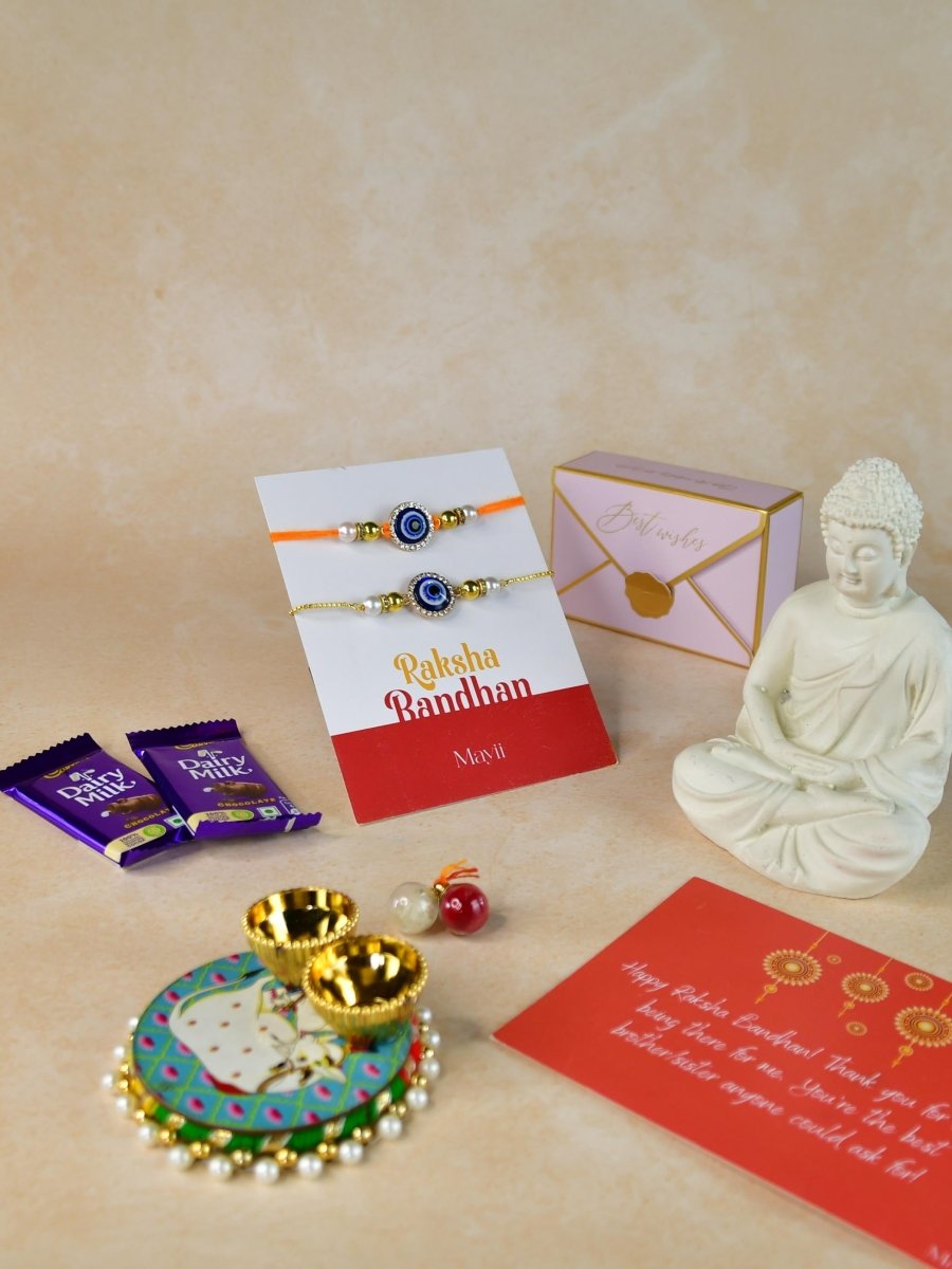 Sowpeace Exquisite Evil Eye Rakhi Pack of 1 with Roli Chawal Thali, Chocolates, Buddha and Greeting card combo for Raksha Bandhan and Gifting