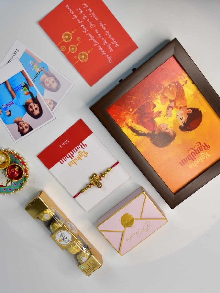 Sowpeace Exquisite Golden Ganesha Rakhi Pack of 1 with Roli Chawal Thali, Chocolates, Photo Frame, Poloroids and Greeting card combo for Raksha Bandhan and Gifting