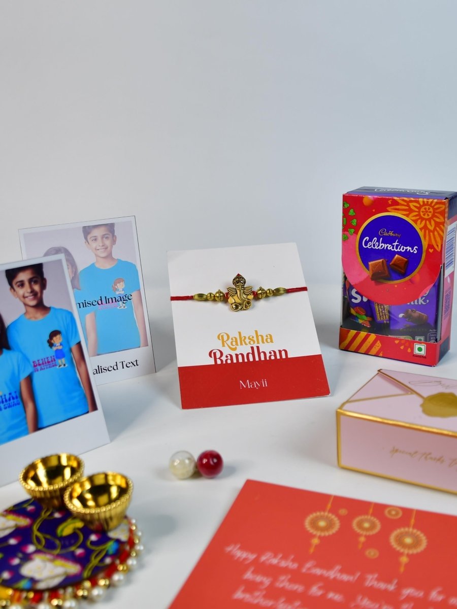 Sowpeace Exquisite Golden Ganesha Rakhi Pack of 1 with Roli Chawal Thali, Chocolates, Poloroids and Greeting card combo for Raksha Bandhan and Gifting