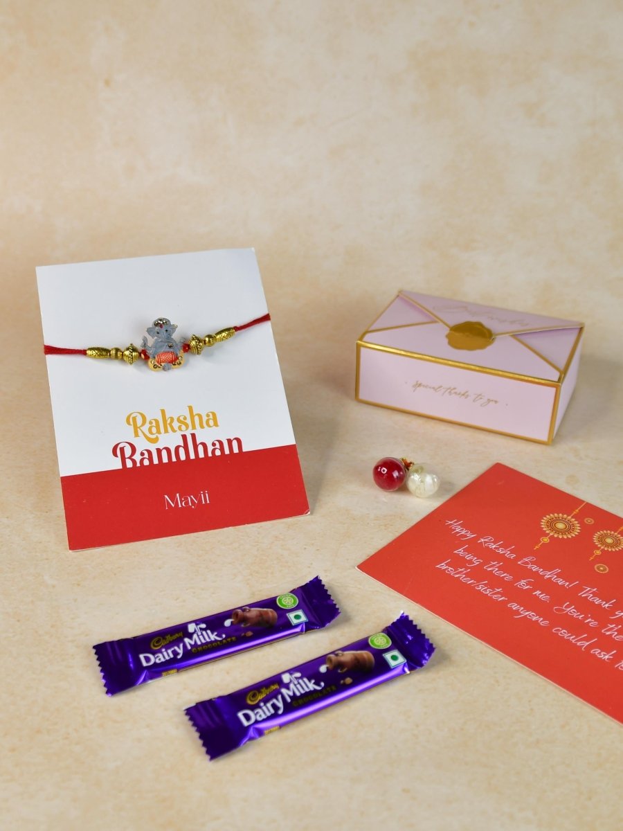 Sowpeace Exquisite Green Ganesha Rakhi Pack of 1 with Roli Chawal Thali, two Chocolates, and Greeting card combo for Raksha Bandhan and Gifting