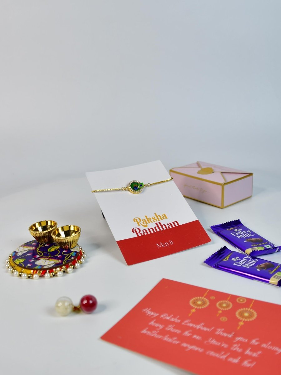 Sowpeace Exquisite Peacock Rakhi Pack of 1 with Roli Chawal Thali, Chocolates, and Greeting card combo for Raksha Bandhan and Gifting