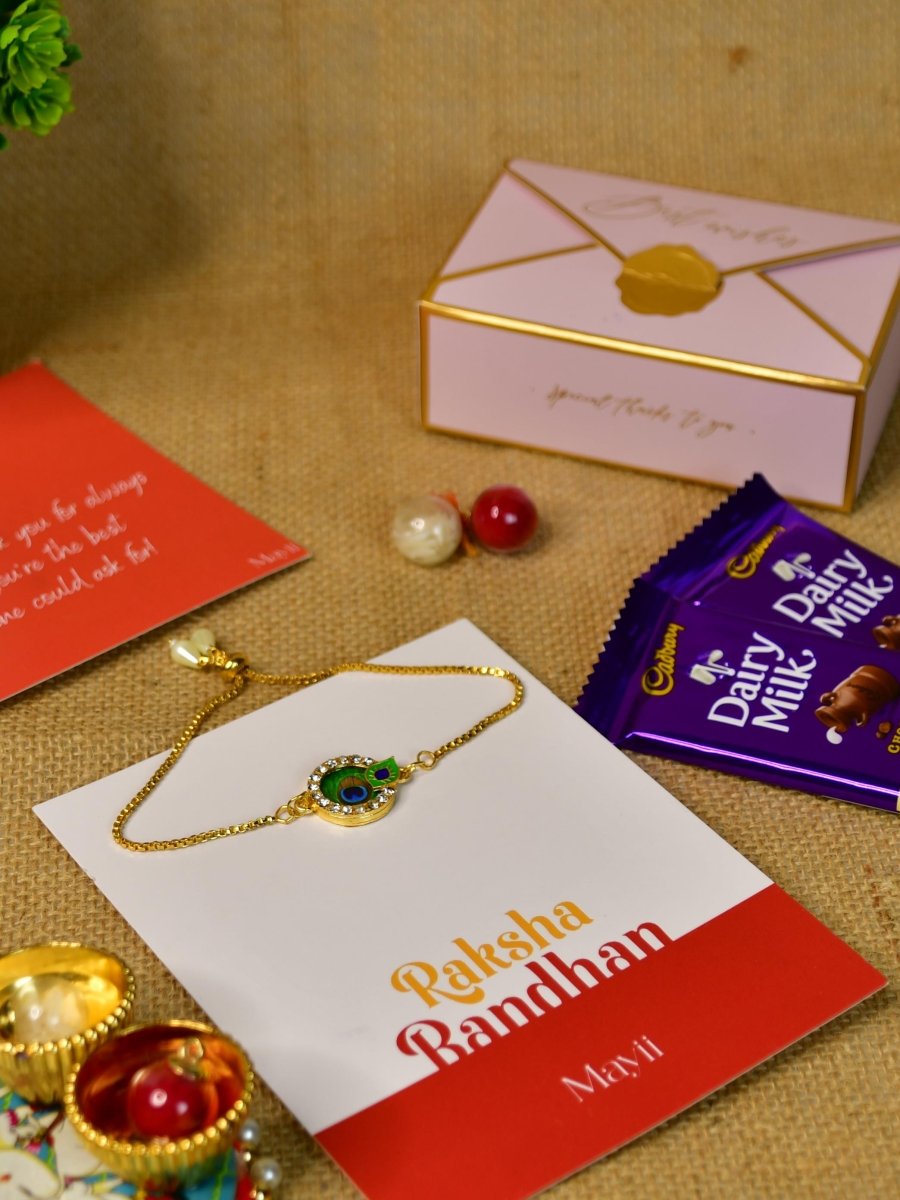 Sowpeace Exquisite Peacock Rakhi Pack of 1 with Roli Chawal Thali, Chocolates, and Greeting card combo for Raksha Bandhan and Gifting