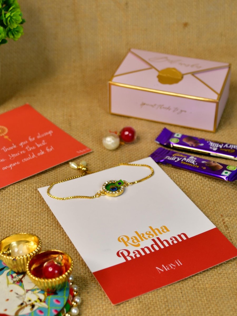 Sowpeace Exquisite Peacock Rakhi Pack of 1 with Roli Chawal Thali, two Chocolates, and Greeting card combo for Raksha Bandhan and Gifting