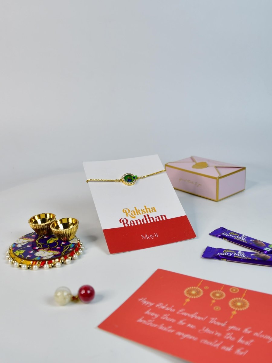 Sowpeace Exquisite Peacock Rakhi Pack of 1 with Roli Chawal Thali, two Chocolates, and Greeting card combo for Raksha Bandhan and Gifting