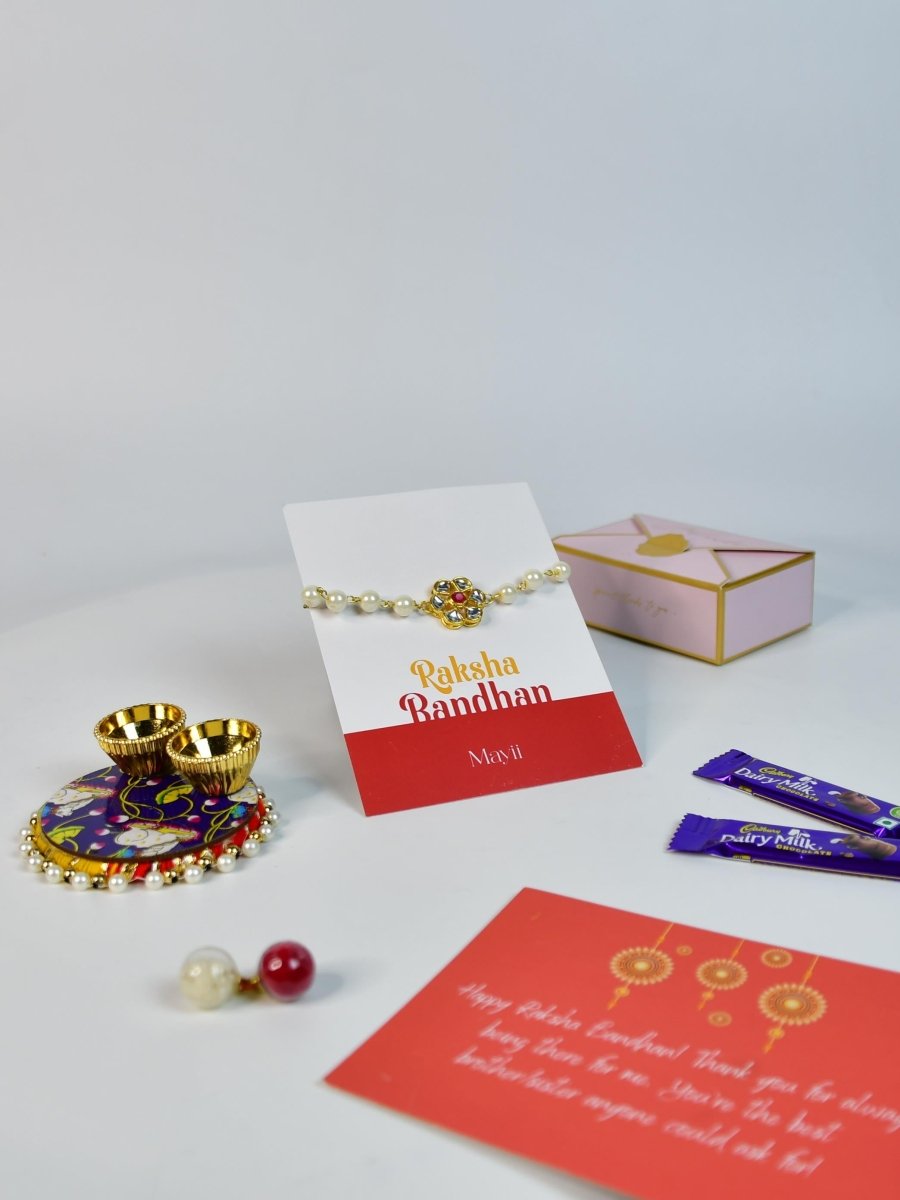 Sowpeace Exquisite Pearl Rakhi Pack of 1 with Roli Chawal Thali, two Chocolates, and Greeting card combo for Raksha Bandhan and Gifting