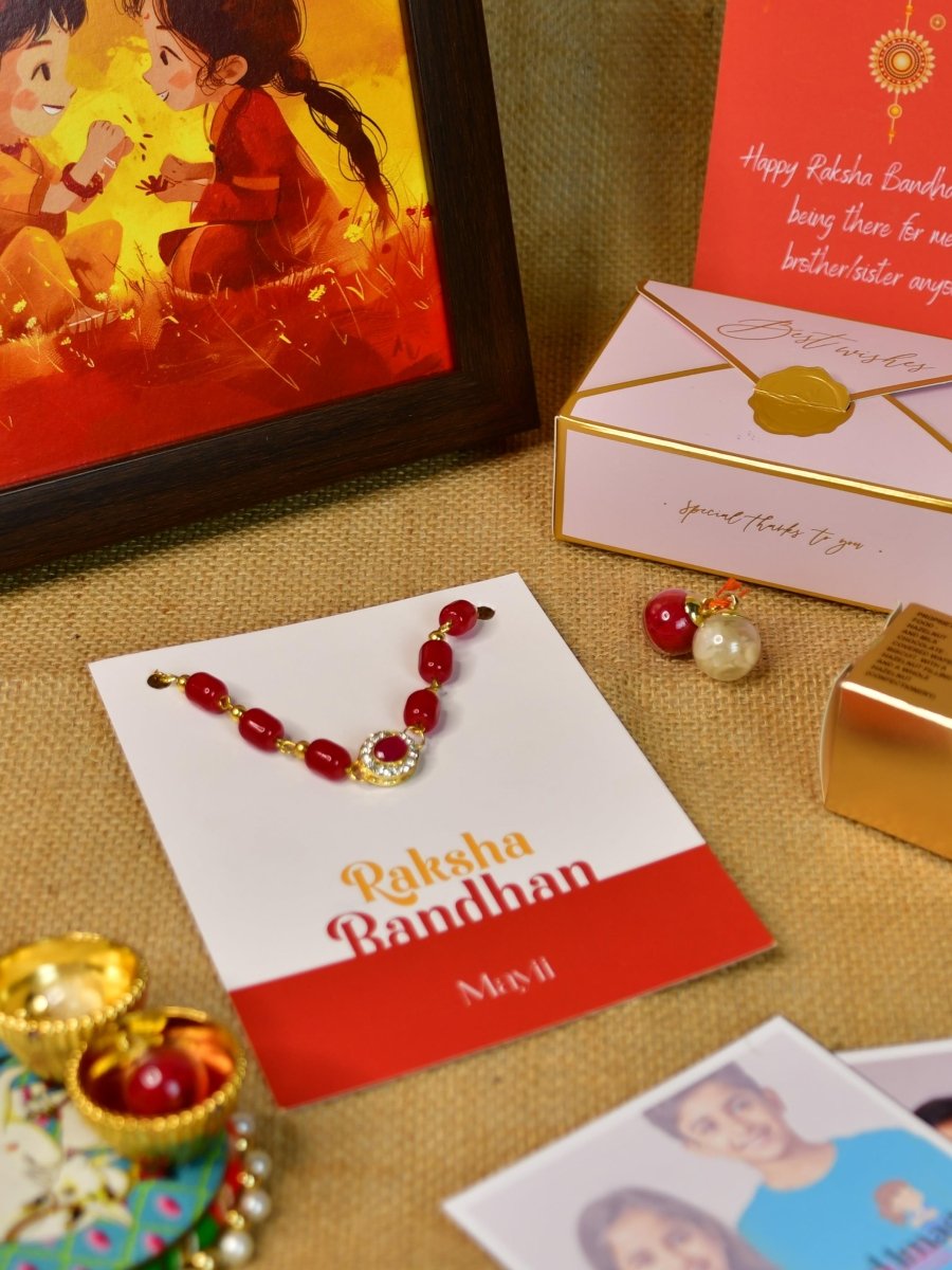 Sowpeace Exquisite Red Beads Rakhi Pack of 1 with Roli Chawal Thali, Chocolates, Photo Frame, Poloroids and Greeting card combo for Raksha Bandhan and Gifting