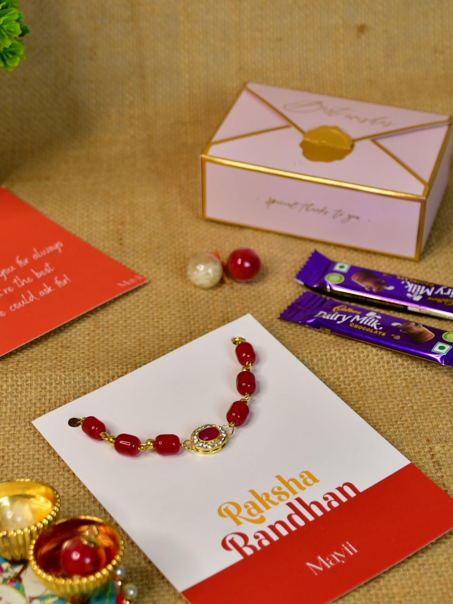 Sowpeace Exquisite Red Beads Rakhi Pack of 1 with Roli Chawal Thali, two Chocolates, and Greeting card combo for Raksha Bandhan and Gifting