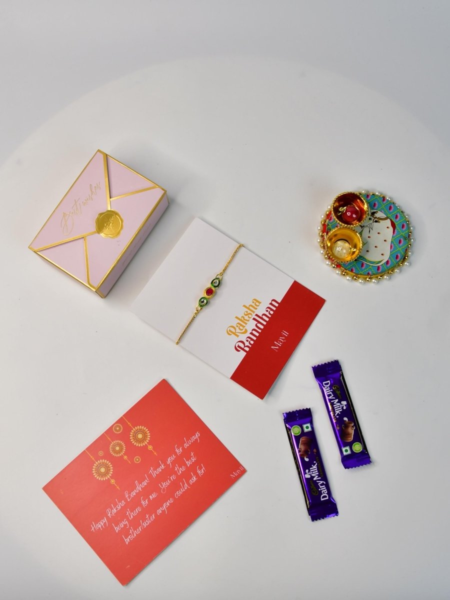 Sowpeace Exquisite Tri Red Green Rakhi Pack of 1 with Roli Chawal Thali, two Chocolates, and Greeting card combo for Raksha Bandhan and Gifting