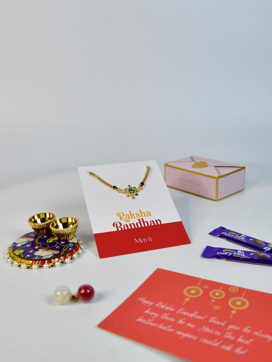 Sowpeace Exquisite Turtle Rakhi Pack of 1 with Roli Chawal Thali, two Chocolates, and Greeting card combo for Raksha Bandhan and Gifting